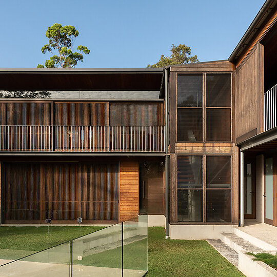 Interior photograph of Bayview Tree House by The skillion roof with clerestory windows facing north allow winter sun to penetrate deep into the floor plate. Photographer: Luke Shadbolt